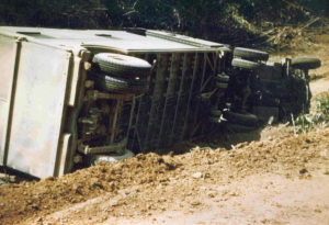 Burma Road_truck slides off muddy road (1)