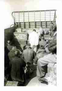 Father Meaus holds Mass aboard a landing craft.