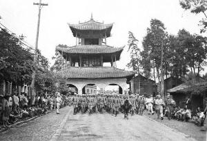 Chinese military parade through city gate