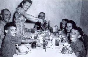 September 10, 1945: Four Taylor children and two classmates eating cake and ice cream to celebrate their freedom.  They were flown out of Weihsien Concentration Camp that morning to the OSS base at Hsi-An (now called Xi-An).  Mary is second from the right.  Her sister, Kathleen, is cutting the cake.